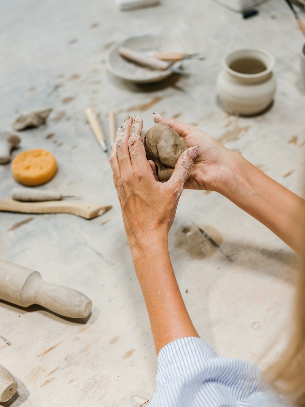 A Person Molding Clay